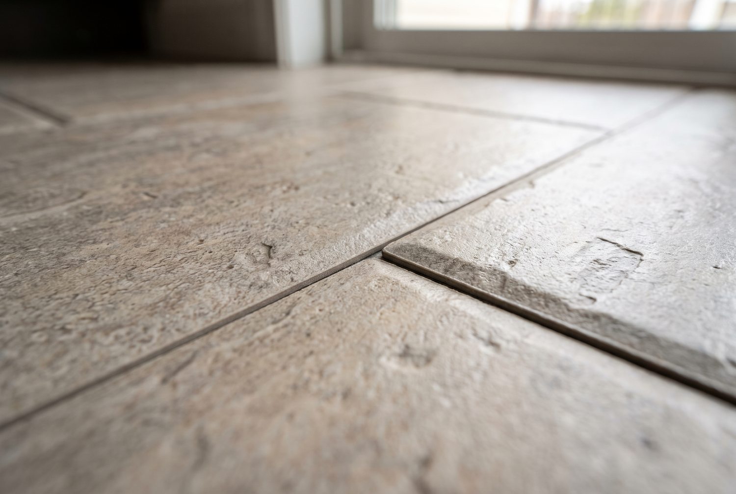 Macro detail of waterproof luxury vinyl tile with a stone look surface